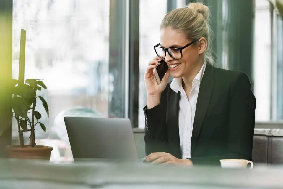 Consultant speaking with a client by telephone