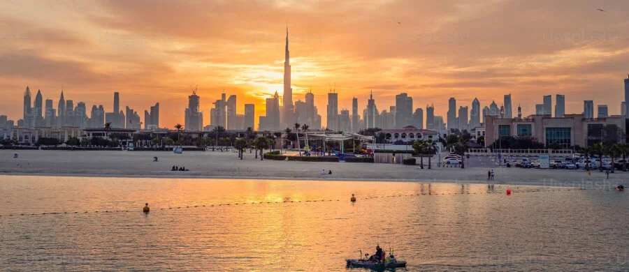 The national flag and an office consultation illustration for company formation in Dubai Mainland.