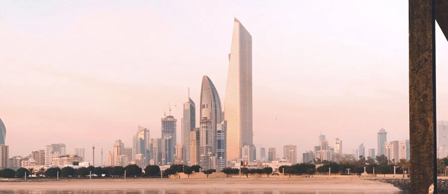 The national flag and an office consultation illustration for company formation in Kuwait.