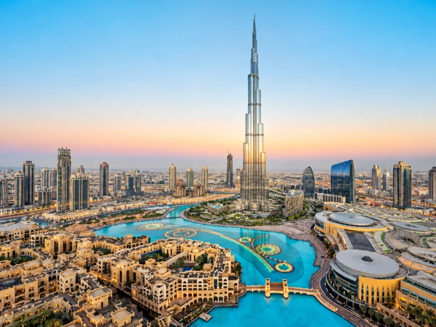 Burj Khalifa, surrounding skyscrapers and turquoise water.